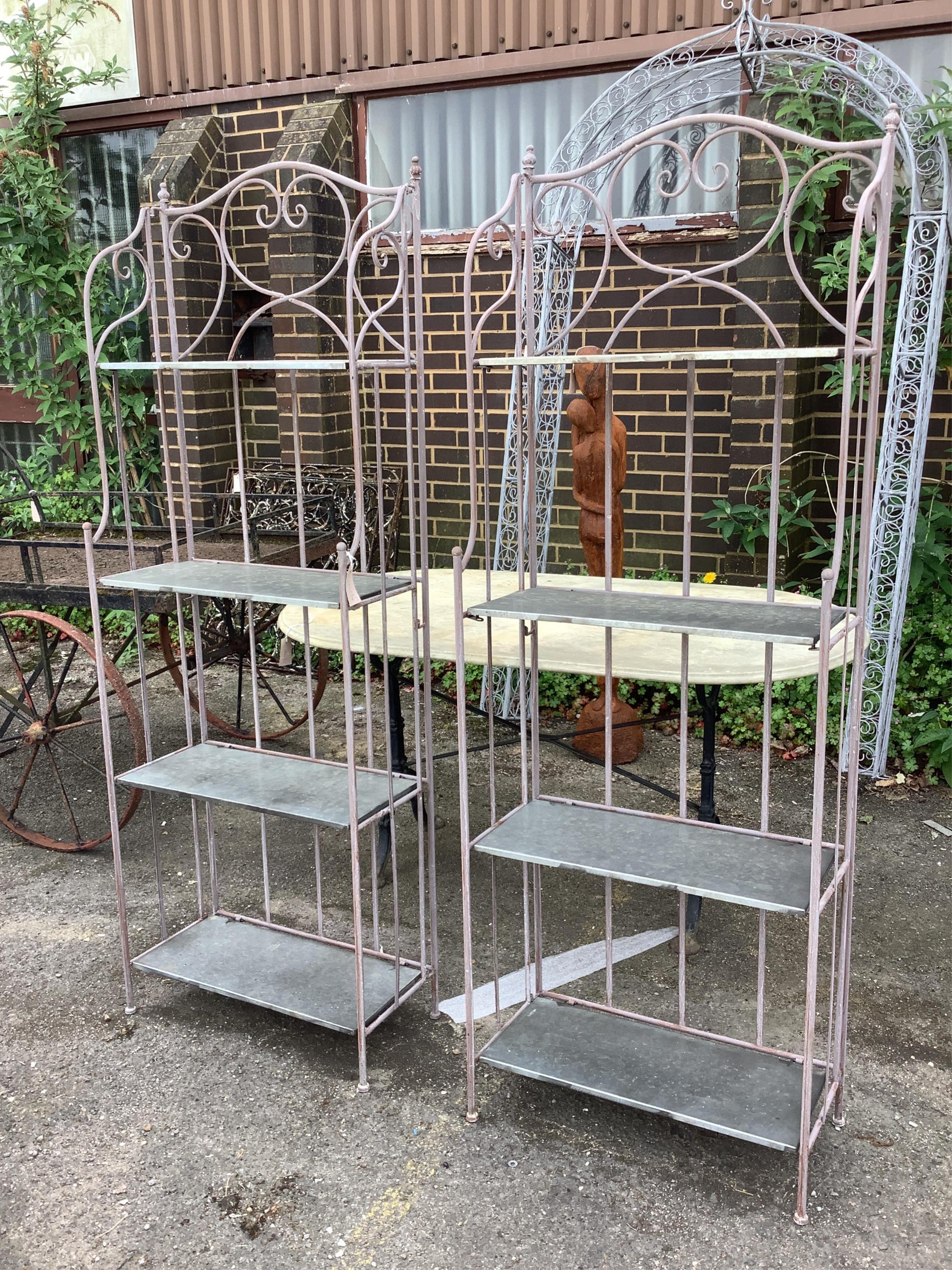 A pair of metal and zinc four tier folding stands, width 58cm, depth 28cm, height 164cm
